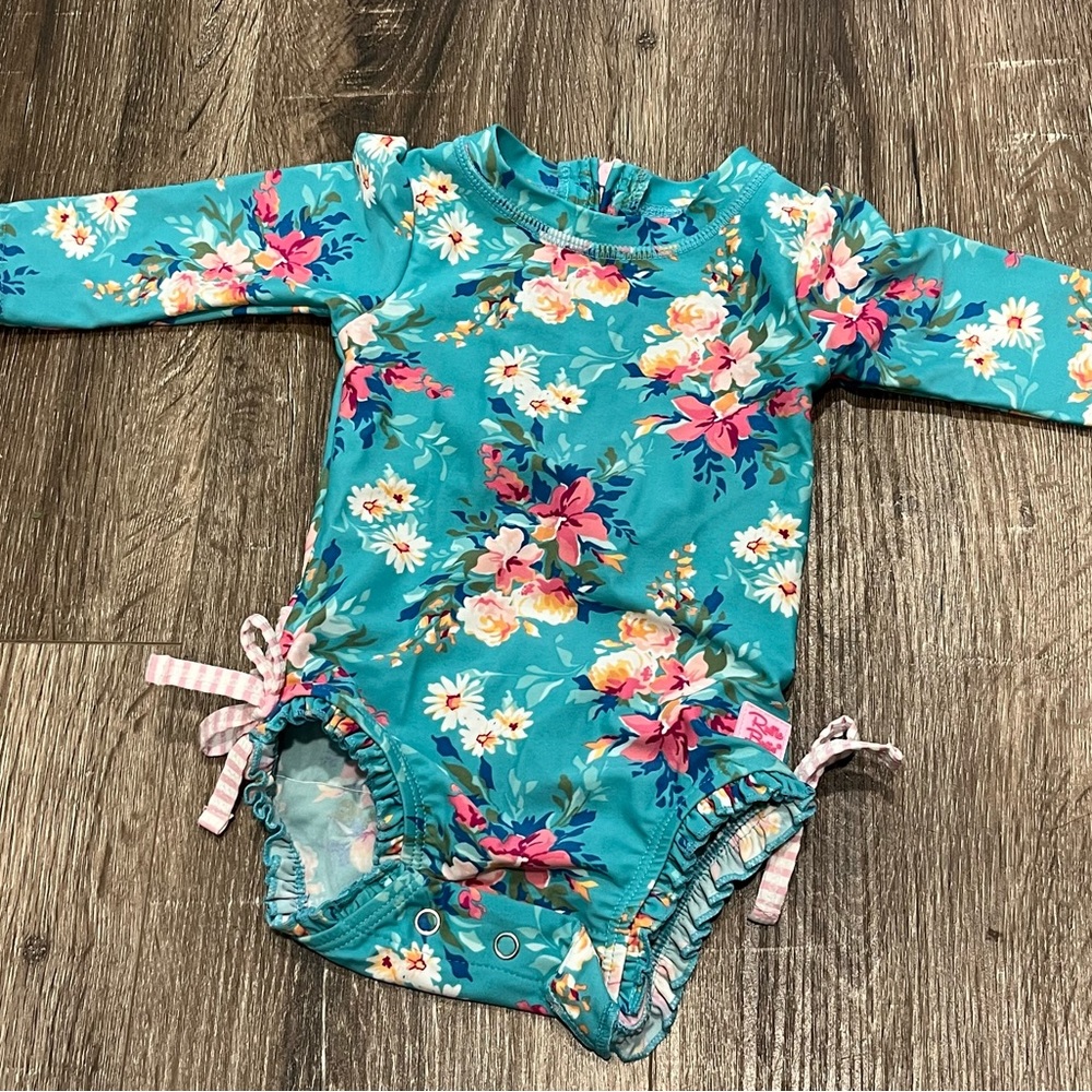 Rufflebutts Long Sleeve One Piece Rash Guard in Fancy Me Floral 3-6 months